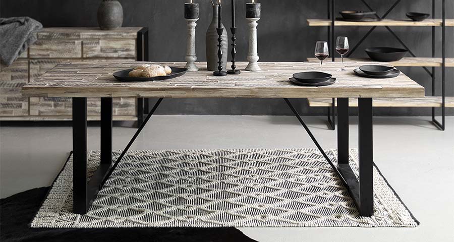 acacia_steel_table_soft_rug_candleholders_dinner_setting